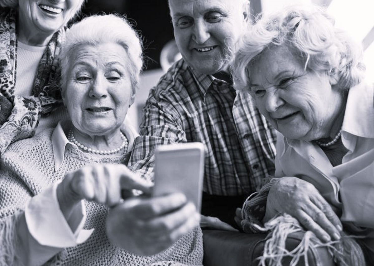 David, caregiver looking at phone